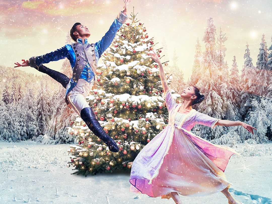 two people leaping into the air from the nutcracker.