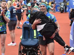 Kevin Sinfield carrying Rob Burrow over the finish line at the Rob Burrow marathon. Credit: Leeds Rhinos