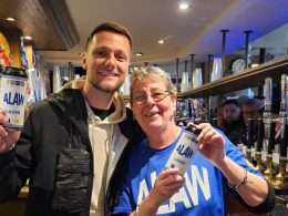 Liam Cooper puts £1k in free drinks behid the bar at The Old Peacock pub in Leeds