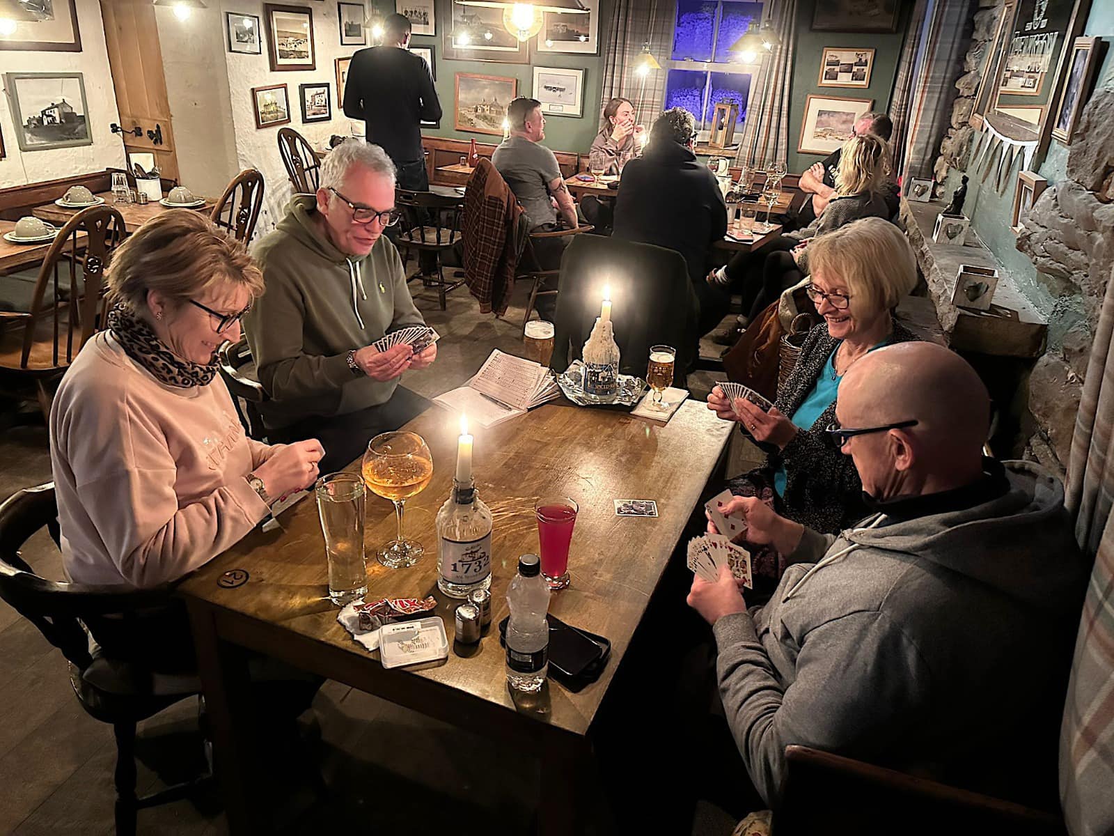 Tan Hill Inn customers playing cards while snowed in. 