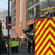 Large cordon in place after vehicle crashes through wall and dangles over Leeds street