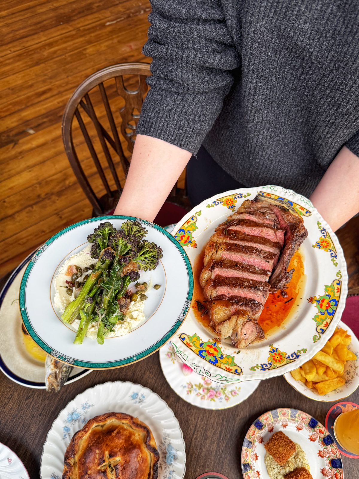 Beef sirloin with wild garlic butter, and purple sprouting broccoli with ricotta and mint