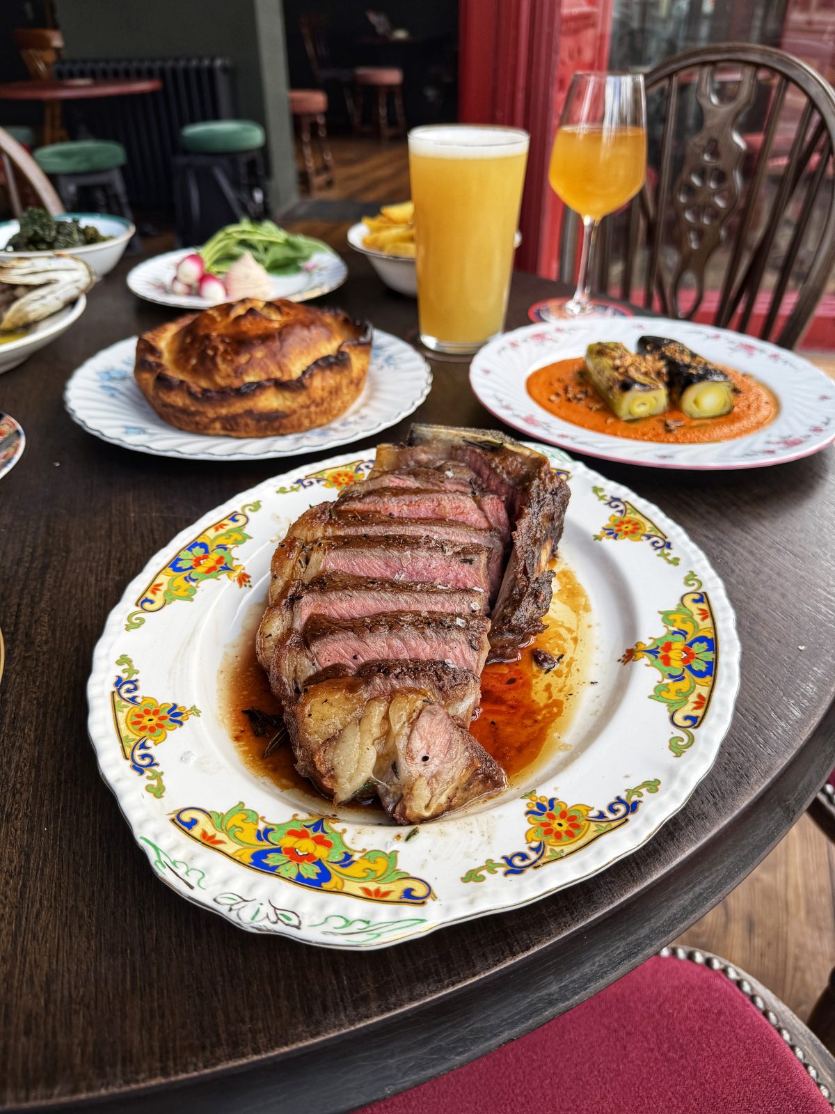 Steak, pie, and charred leeks
