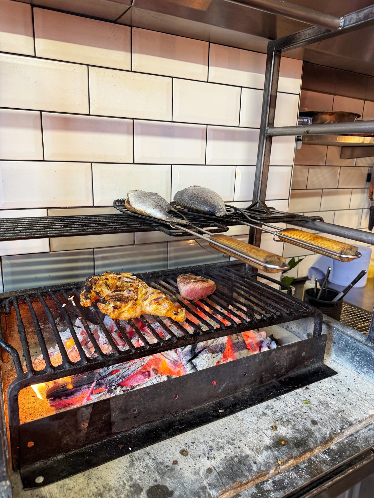 They cook dishes over a typical South African braai
